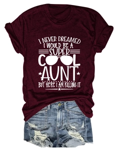 Detail of wine red t-shirt with Super Cool Aunt text and distressed denim shorts