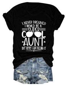 Detail of black cotton T-shirt with white text print paired with denim shorts
