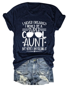 Close-up of navy crew neck t-shirt with print and distressed denim shorts outfit set