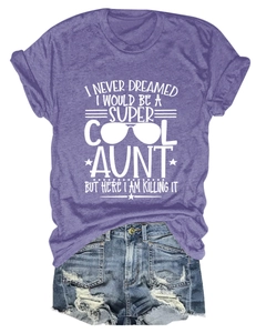 Flat lay of purple cotton t-shirt with aunt theme print and distressed denim shorts