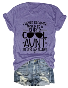 Flat lay of purple cotton T-shirt with graphic print and distressed denim shorts