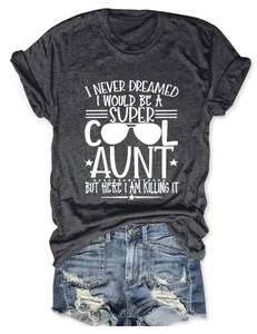 Flat lay of a grey cotton aunt quote t-shirt paired with distressed denim shorts