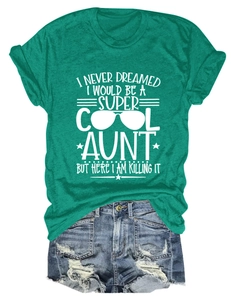 Flat lay of green cotton t-shirt with slogan and distressed denim shorts with raw hem