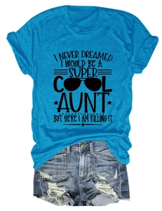 Close-up of vibrant blue cotton T-shirt with cool aunt slogan and distressed denim shorts