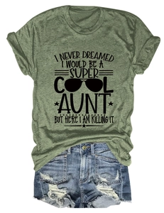 Detail of olive green t-shirt with aunt quote print and distressed denim shorts