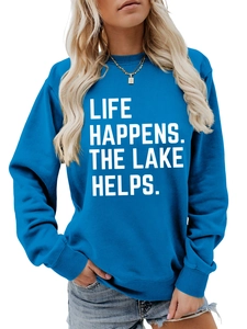 Close-up of Life Happens Lake Helps slogan print on casual blue long sleeve sweatshirt