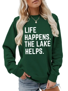 Detail of dark green sweatshirt with white LIFE HAPPENS THE LAKE HELPS slogan print
