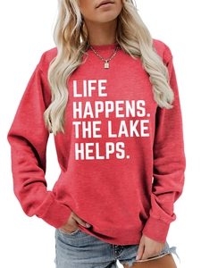 Close-up of Life Happens print on red long-sleeve sweatshirt with ribbed crew neck details