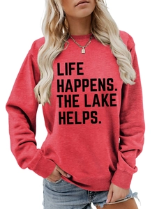 Detail of red crewneck sweatshirt with Life Happens The Lake Helps bold black print