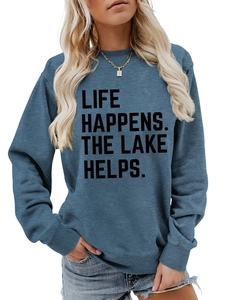 Detail of the navy crewneck sweatshirt showing Life Happens The Lake Helps slogan print