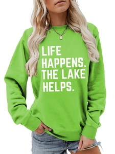 Detail of white printed text Life Happens The Lake Helps on green casual sweatshirt