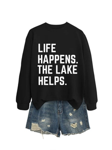 Detail view of cotton sweatshirt with white Life Happens lettering and distressed denim shorts