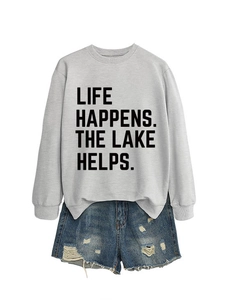 Detail of grey graphic sweatshirt with Lake lettering and distressed denim shorts
