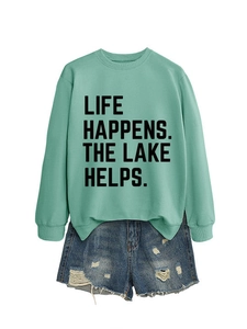 Detail of mint green sweatshirt with Life Happens letter print and denim shorts