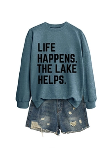 Detail view of blue long sleeve sweatshirt with Life Happens The Lake Helps slogan print
