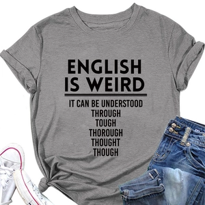 Flat lay of grey 'English is Weird' graphic tee with jeans and canvas shoes
