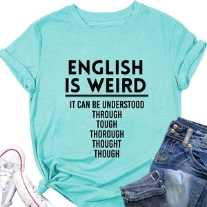 Flat lay of a mint green t-shirt with slogan, paired with denim jeans and sneakers