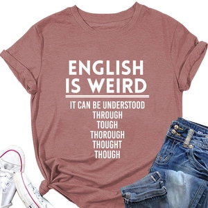 Flat lay of dusty rose cotton T-shirt with English Is Weird text and denim shorts