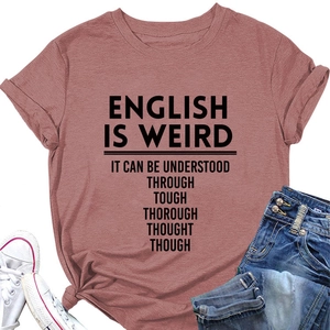 Flat lay of mauve T-shirt with English Is Weird slogan, denim jeans and sneakers