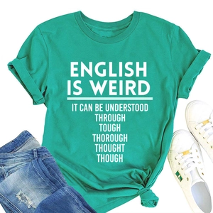 Flat lay of a teal cotton t-shirt with slogan print, styled with jeans and sneakers