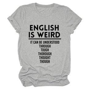 Detail of the English is Weird text print on a light grey crew neck short sleeve T-shirt