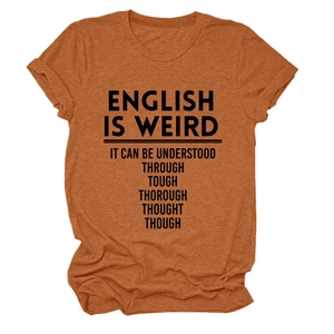 Detail of the English is Weird slogan print on a burnt orange crew neck cotton T-shirt