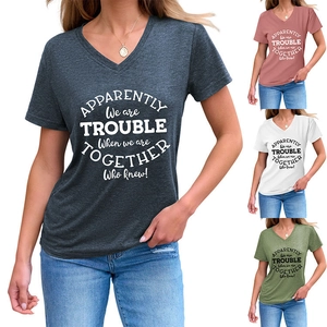 Detail of V-neck T-shirt showing text print and multiple color options including olive and grey