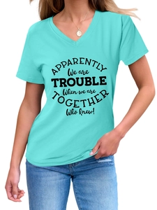 Detail view of V-neck light blue t-shirt with black artistic slogan print for women