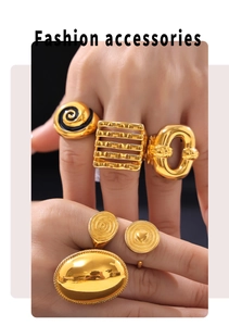 Close-up of assorted gold geometric rings with tortoiseshell and spiral textures