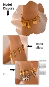 Detail of 18K gold plated titanium bracelet with multi-element crystal pendants