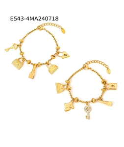 Detail of 18K gold plated steel bracelets featuring multiple fashion charms and pavé zircon