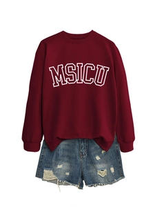 Flat lay of a burgundy crewneck sweatshirt with MSICU print and distressed denim shorts