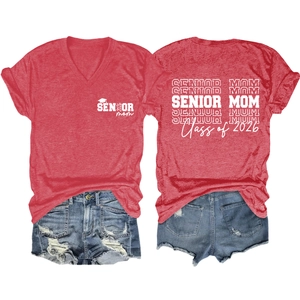 Flat lay of red V-neck T-shirt and denim shorts with Senior Mom Class of 2026 print