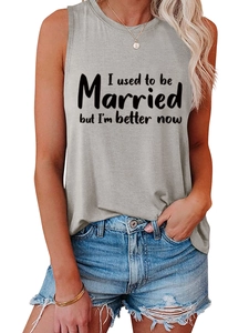 Close-up of grey cotton tank top with black text print paired with denim shorts