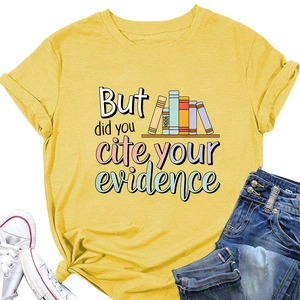 Flat lay of yellow t-shirt with 'But did you cite your evidence' text and book graphic
