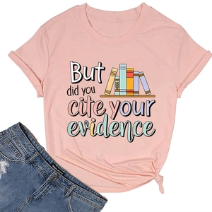 Detail of pink cotton T-shirt featuring book print and side-knot hem detail