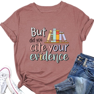 Flat lay of a dusty rose crew neck T-shirt with vintage academic book graphic and quote