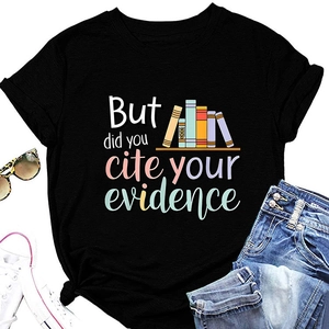 Flat lay of black round neck T-shirt with 'But did you cite your evidence' text and books