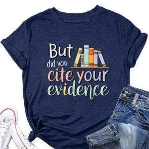 Flat lay of navy blue T-shirt with 'But did you cite your evidence' text and book print