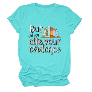 Detail of turquoise cotton T-shirt featuring academic text and colorful book graphics