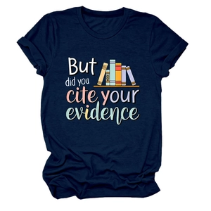 Close-up of academic humor text and colorful book graphics on a navy blue t-shirt