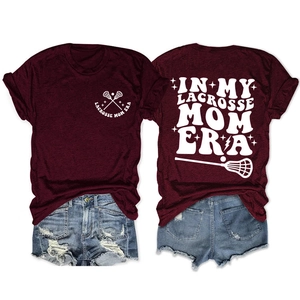 Front and back view of burgundy Lacrosse Mom Era t-shirt with sports graphic and denim shorts