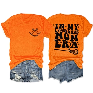 Front and back detail of orange Lacrosse Mom cotton t-shirt with distressed denim shorts