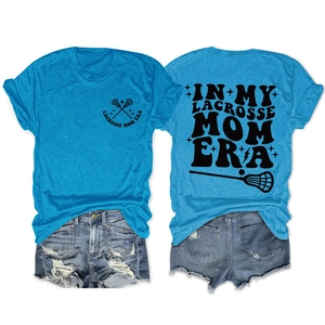 Detail view of bright blue lacrosse mom t-shirt with back print and denim shorts