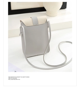 Detail of grey and beige PU leather crossbody phone bag with buckle strap