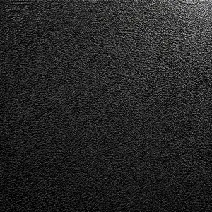 Close-up of high-quality black litchi grain leather texture on minimalist phone pouch