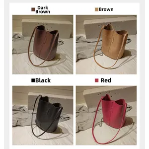 Four vintage bucket bags in dark brown, brown, black, and red with fine leather texture