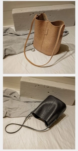 Detail of minimalist bucket bag with pleated leather texture and vertical brand logo