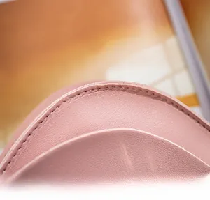 Macro detail of high-quality pink saddle bag showing durable and neat stitching craftsmanship