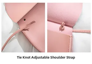 Close-up of pink leather saddle bag with knotted adjustable shoulder strap detail